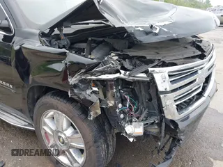 2015 Chevrolet Suburban LTZ with VIN 1GNSCKKC6FR271675, listed as a IAAI auction lot 41915036 with 150,917 mi miles. Bid and sale history available at carsss.com. Image 6.