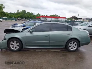 2003 Nissan Altima S z VIN 1N4AL11DX3C295443, wystawiony jako IAAI lot #42278216 z przebiegiem 145 415 mil mil oraz . Historia ofert i sprzedaży dostępna na DreamBid. Obrazek 14.
