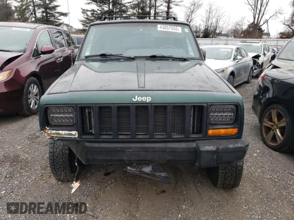 1999 Jeep Cherokee SE with VIN 1J4FF28S3XL551875, listed as a Copart auction lot 43057555 with 226,794 mi miles and Salvage title. Bid and sale history available at DreamBid. Image 5.
