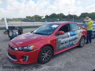 2016 Mitsubishi Lancer ES with VIN JA32U2FU2GU006936, listed as a IAAI auction lot 41930010 with 104,063 mi miles. Bid and sale history available at carsss.com. Image 2.