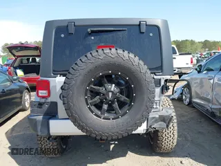 2015 Jeep Wrangler Unlimited Sahara with VIN 1C4BJWEG2FL558860, listed as a IAAI auction lot 41937360 with 113,627 mi miles. Bid and sale history available at carsss.com. Image 17.