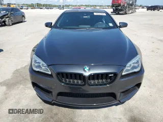 2016 BMW M6 z VIN WBS6J9C59GD934530, wystawiony jako Copart lot #72057354 z przebiegiem 46 549 mil mil oraz Nie do naprawy. Historia ofert i sprzedaży dostępna na DreamBid. Obrazek 4.