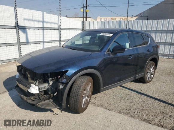 2021 Mazda CX-5 Grand Touring with VIN JM3KFADM7M0385788, listed as a Copart auction lot 88065255 with 27,787 mi miles and Salvage Title. Bid and sale history available at carsss.com. Image 1.