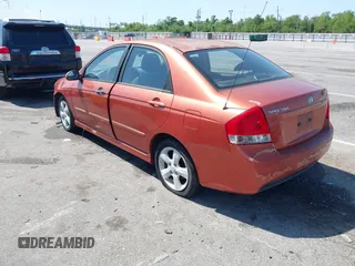 2009 Kia Spectra EX with VIN KNAFE221195026956, listed as a IAAI auction lot 42019309 with 121,341 mi miles. Bid and sale history available at carsss.com. Image 3.