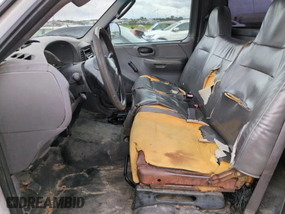 2003 Ford F-150 XL with VIN 1FTRF17W03NA02988, listed as a Copart auction lot 77209084 with Not Provided miles and Salvage Title. Bid and sale history available at DreamBid. Image 7.