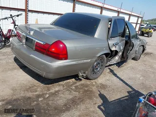2004 Mercury Grand Marquis GS with VIN 2MEFM74W94X674014, listed as a IAAI auction lot 41973693 with 163,865 mi miles. Bid and sale history available at carsss.com. Image 4.