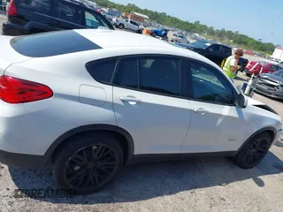 2015 BMW X4 xDrive28i with VIN 5UXXW3C59F0M88331, listed as a IAAI auction lot 42093953 with 138,205 mi miles and . Bid and sale history available at DreamBid. Image 13.