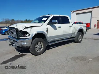 2018 Ram 2500 Laramie z VIN 3C6UR5FL4JG404249, wystawiony jako IAAI lot #41965199 z przebiegiem 123 506 mil mil oraz . Historia ofert i sprzedaży dostępna na DreamBid. Obrazek 2.