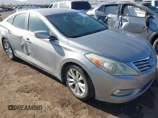 2012 Hyundai Azera with VIN KMHFG4JG2CA169486, listed as a IAAI auction lot 41719929 with 166,496 mi miles. Bid and sale history available at carsss.com. Image 1.