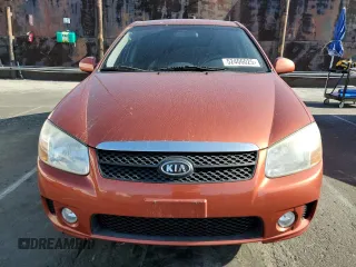2009 Kia Spectra EX with VIN KNAFE222995027376, listed as a Copart auction lot 52406025 with 73,692 mi miles and Salvage Title. Bid and sale history available at DreamBid. Image 5.