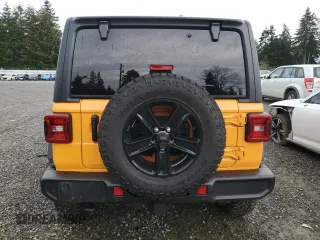 2021 Jeep Wrangler Unlimited Willys with VIN 1C4HJXDMXMW658305, listed as a Copart auction lot 85658534 with 65,653 mi miles and Salvage title. Bid and sale history available at DreamBid. Image 6.