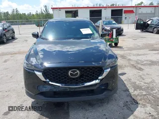 2023 Mazda CX-5 2.5 S Premium Plus Package with VIN JM3KFBEM5P0256652, listed as a IAAI auction lot 41936376 with 31,332 mi miles. Bid and sale history available at carsss.com. Image 12.