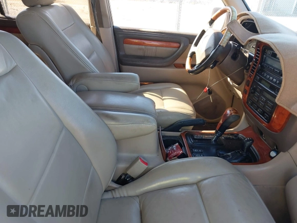 2000 Lexus LX 470 with VIN JT6HT00WXY0079873, listed as a IAAI auction lot 41605770 with 302,758 mi miles and . Bid and sale history available at DreamBid. Image 5.