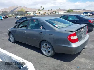 2003 Toyota Camry LE with VIN JTDBE32K130149032, listed as a IAAI auction lot 42063174 with 241,424 mi miles and . Bid and sale history available at DreamBid. Image 3.