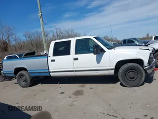 1996 GMC Sierra 1500 with VIN 1GTGC33R4TF018147, listed as a IAAI auction lot 41612770 with 106,443 mi miles and . Bid and sale history available at DreamBid. Image 13.