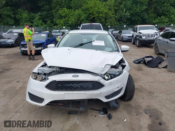 2018 Ford Focus SE z VIN 1FADP3F24JL247003, wystawiony jako IAAI lot #42531969 z przebiegiem 55 344 mil mil oraz . Historia ofert i sprzedaży dostępna na DreamBid. Obrazek 12.