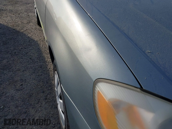 2004 Toyota Corolla CE with VIN JTDBR38E842043849, listed as a IAAI auction lot 41703290 with 299,999 mi miles. Bid and sale history available at carsss.com. Image 6.