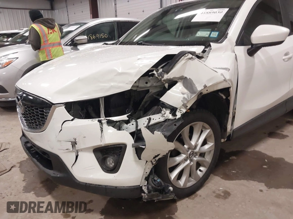 2014 Mazda CX-5 Grand Touring with VIN JM3KE4DY3E0374036, listed as a IAAI auction lot 41889030 with 162,611 mi miles and . Bid and sale history available at DreamBid. Image 6.