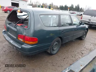 1996 Toyota Camry LE z VIN 4T1EF12K9TU116427, wystawiony jako IAAI lot #38696498 z przebiegiem 242 599 mil mil oraz . Historia ofert i sprzedaży dostępna na DreamBid. Obrazek 4.