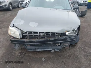 2002 Hyundai Accent GL z VIN KMHCG45C52U372587, wystawiony jako IAAI lot #42244428 z przebiegiem 43 538 mil mil oraz . Historia ofert i sprzedaży dostępna na DreamBid. Obrazek 6.