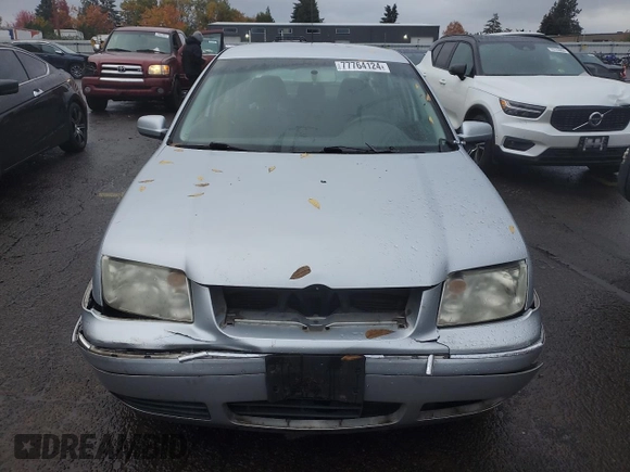 2004 Volkswagen Jetta GL z VIN 3VWRK69M54M030184, wystawiony jako Copart lot #77764124 z przebiegiem 97 634 mil mil oraz Szkoda całkowita • Salvage title. Historia ofert i sprzedaży dostępna na DreamBid. Obrazek 5.