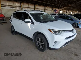2018 Toyota RAV4 XLE with VIN JTMWFREV2JJ740145, listed as a Copart auction lot 52214075 with 129,940 mi miles and Salvage title. Bid and sale history available at DreamBid. Image 4.