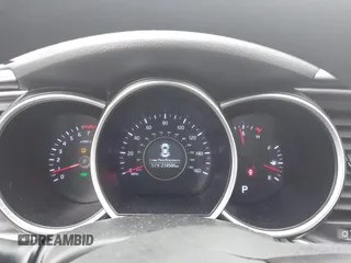 2015 Kia Optima LX with VIN KNAGM4A70F5571034, listed as a IAAI auction lot 41734211 with 214,948 mi miles. Bid and sale history available at carsss.com. Image 7.