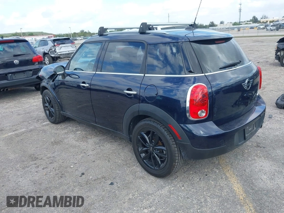 2013 MINI Countryman with VIN WMWZB3C58DWM07817, listed as a IAAI auction lot 41962291 with 60,763 mi miles and . Bid and sale history available at DreamBid. Image 3.
