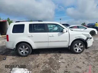 2013 Honda Pilot Touring z VIN 5FNYF4H99DB017351, wystawiony jako IAAI lot #42355167 z przebiegiem 122 191 mil mil oraz . Historia ofert i sprzedaży dostępna na DreamBid. Obrazek 13.