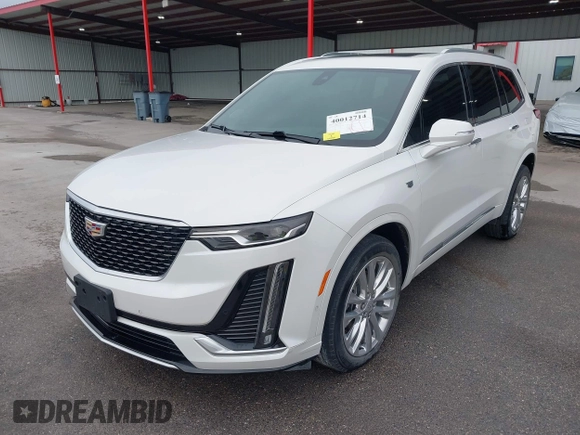2021 Cadillac XT6 Premium Luxury z VIN 1GYKPCRS8MZ233209, wystawiony jako IAAI lot #40012714 z przebiegiem 45 599 mil mil oraz . Historia ofert i sprzedaży dostępna na DreamBid. Obrazek 18.