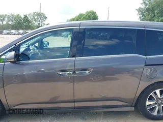 2014 Honda Odyssey Touring with VIN 5FNRL5H99EB138952, listed as a IAAI auction lot 42538833 with 146,959 mi miles and . Bid and sale history available at DreamBid. Image 14.
