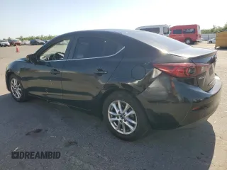 2016 Mazda 3 i Touring with VIN JM1BM1V72G1296409, listed as a Copart auction lot 59008785 with 124,738 mi miles and Salvage title. Bid and sale history available at DreamBid. Image 2.