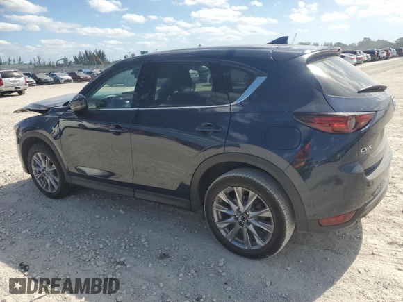 2021 Mazda CX-5 Grand Touring with VIN JM3KFADM1M0301366, listed as a Copart auction lot 52890955 with 66,686 mi miles and Non Repairable. Bid and sale history available at carsss.com. Image 2.