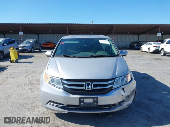 2014 Honda Odyssey EX-L with VIN 5FNRL5H63EB041106, listed as a IAAI auction lot 42294113 with 122,610 mi miles and . Bid and sale history available at DreamBid. Image 13.