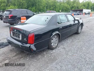 2002 Cadillac DeVille DTS z VIN 1G6KF579320288667, wystawiony jako IAAI lot #42331236 z przebiegiem 71 189 mil mil oraz . Historia ofert i sprzedaży dostępna na DreamBid. Obrazek 4.