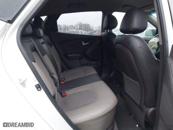 2013 Hyundai Tucson GLS with VIN KM8JU3AC1DU713695, listed as a IAAI auction lot 41461134 with 118,789 mi miles. Bid and sale history available at carsss.com. Image 8.