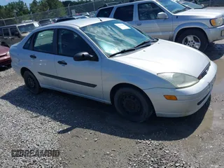 2002 Ford Focus LX z VIN 1FAFP33P02W219739, wystawiony jako IAAI lot #42544002 z przebiegiem 135 589 mil mil oraz . Historia ofert i sprzedaży dostępna na DreamBid. Obrazek 1.