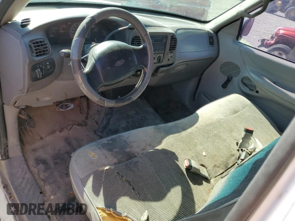 1998 Ford F-150 with VIN 1FTZX1720WKA20813, listed as a Copart auction lot 63852215 with 215,729 mi miles and Salvage title. Bid and sale history available at DreamBid. Image 8.