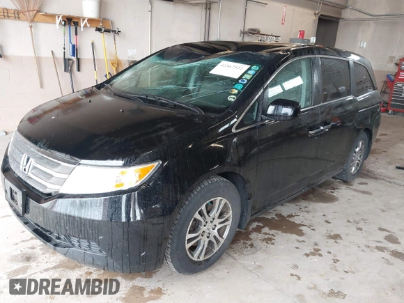2012 Honda Odyssey EX z VIN 5FNRL5H4XCB017557, wystawiony jako IAAI lot #42367322 z przebiegiem 209 630 mil mil oraz . Historia ofert i sprzedaży dostępna na DreamBid. Obrazek 17.
