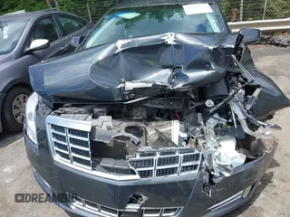2013 Cadillac XTS Luxury z VIN 2G61P5S34D9109189, wystawiony jako IAAI lot #42242533 z przebiegiem 178 234 mil mil oraz . Historia ofert i sprzedaży dostępna na DreamBid. Obrazek 12.