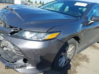 2019 Toyota Camry LE with VIN 4T1B11HK4KU254853, listed as a IAAI auction lot 42013255 with 153,664 mi miles and . Bid and sale history available at DreamBid. Image 20.