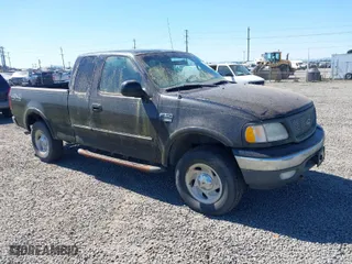 2000 Ford F-150 XL with VIN 1FTRX18L6YKB06492, listed as a IAAI auction lot 42058110 with 169,217 mi miles. Bid and sale history available at carsss.com. Image 1.