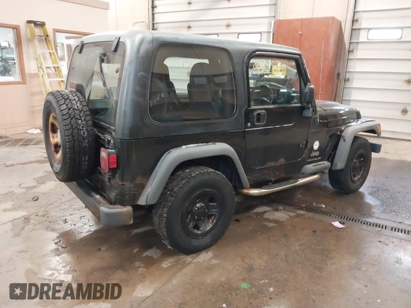 2003 Jeep Wrangler Sport Right Hand Drive with VIN 1J4F449S63P359031, listed as a IAAI auction lot 41495087 with 126,678 mi miles. Bid and sale history available at carsss.com. Image 4.