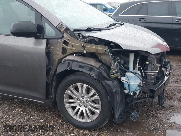 2014 Toyota Sienna XLE with VIN 5TDYK3DC0ES502482, listed as a IAAI auction lot 41910683 with 151,330 mi miles. Bid and sale history available at carsss.com. Image 6.