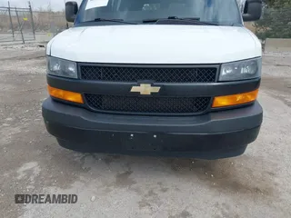 2018 Chevrolet Express Cargo Van with VIN 1GCWGAFP6J1336229, listed as a IAAI auction lot 42022722 with 99,005 mi miles. Bid and sale history available at carsss.com. Image 6.