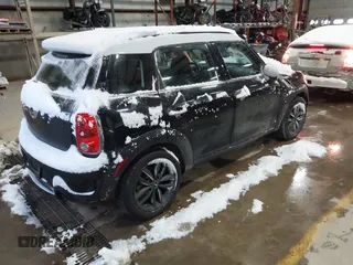 2014 MINI Countryman S with VIN WMWZC5C57EWP39161, listed as a IAAI auction lot 41342912 with 108,459 mi miles and . Bid and sale history available at DreamBid. Image 4.