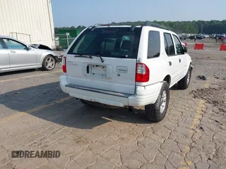 2002 Isuzu Rodeo S with VIN 4S2CK58W524321108, listed as a IAAI auction lot 42352330 with 270,614 mi miles and . Bid and sale history available at DreamBid. Image 4.