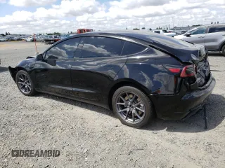 2023 Tesla Model 3 with VIN 5YJ3E1EA6PF454254, listed as a Copart auction lot 56881355 with 30,327 mi miles and Salvage title. Bid and sale history available at DreamBid. Image 2.