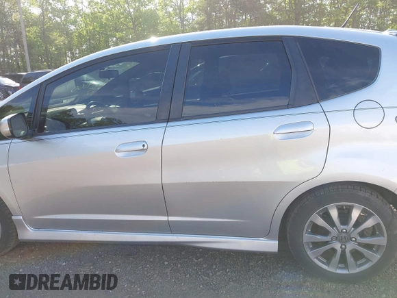 2013 Honda Fit Sport z VIN JHMGE8H69DC033802, wystawiony jako IAAI lot #42149500 z przebiegiem 144 980 mil mil oraz . Historia ofert i sprzedaży dostępna na DreamBid. Obrazek 14.
