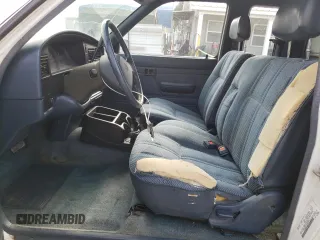 1993 Toyota Pickup DLX z VIN JT4RN93P7P5074129, wystawiony jako Copart lot #72893054 z przebiegiem 235 053 mil mil oraz Szkoda całkowita • Salvage title. Historia ofert i sprzedaży dostępna na DreamBid. Obrazek 7.